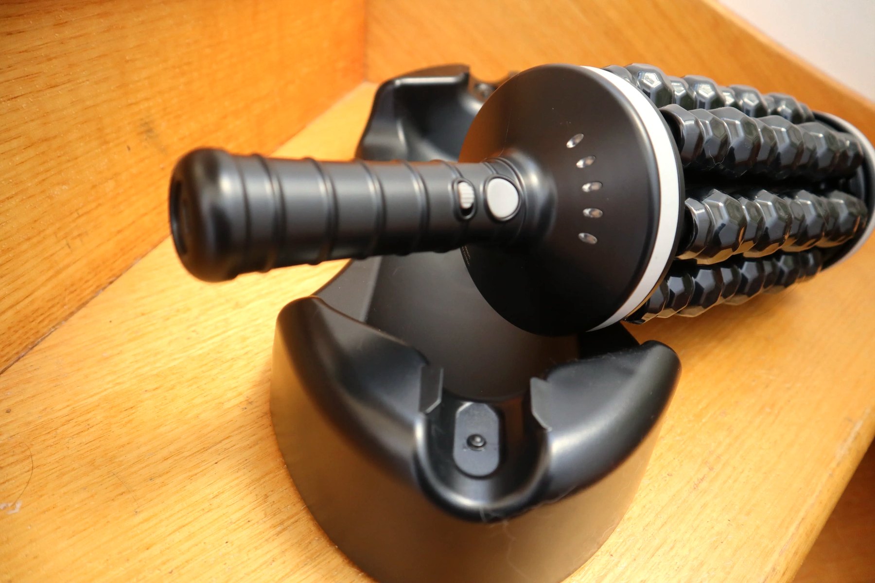 Control button and charging contacts close-up